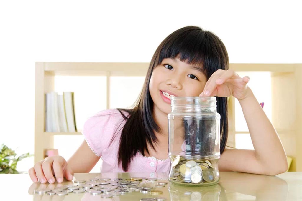 Asian girl saving money