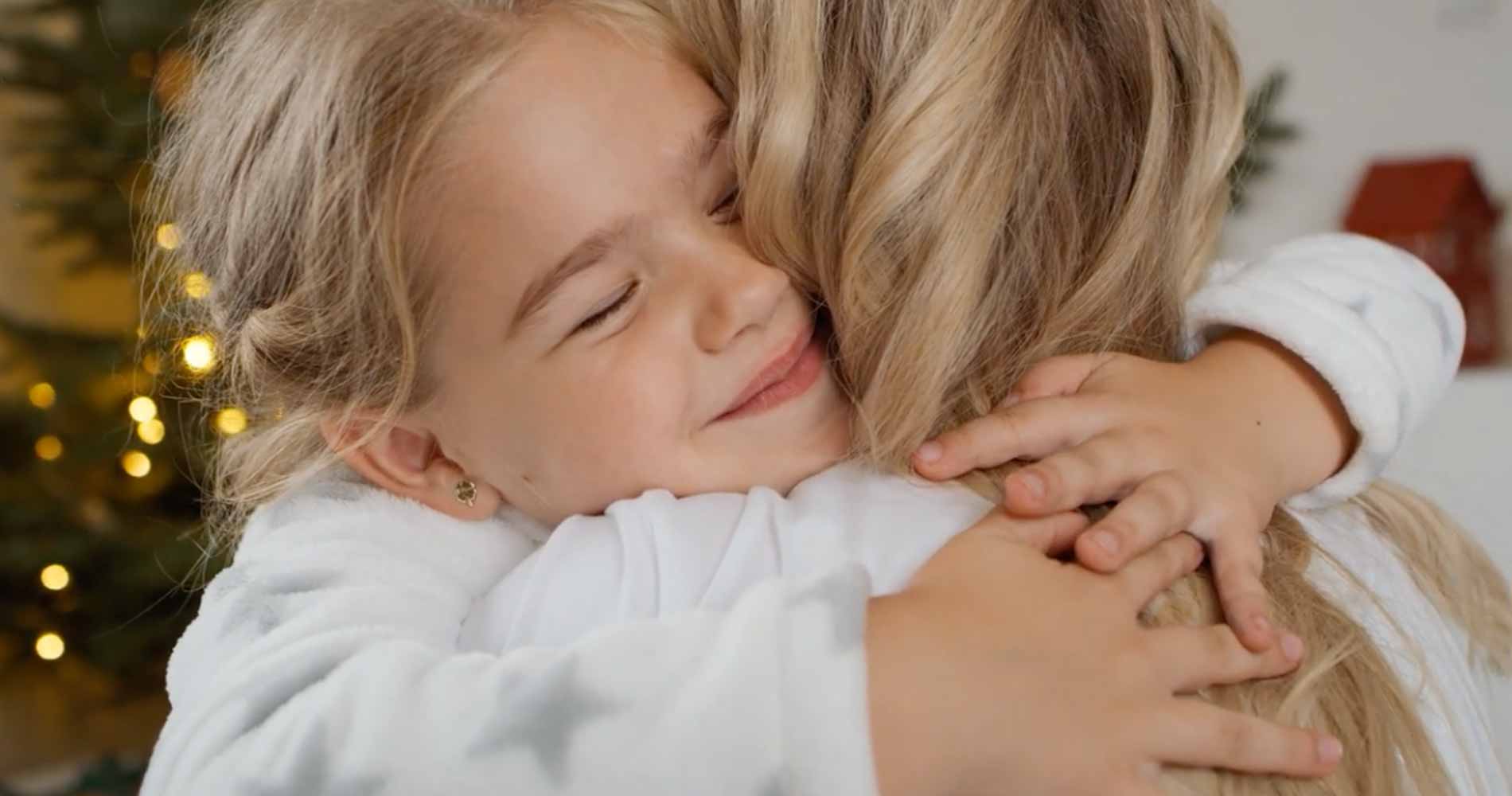 Daughter hugging Mom