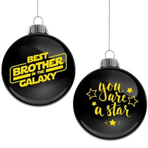 Introducing unique holiday ornaments perfect for your next school or organization fundraiser! Capture the excitement of the season with our exclusive black Christmas ornaments, guaranteed to light up any space. Featured in our catalog: 1. "Best Brother in the Galaxy" – Celebrate sibling pride with this stellar message in radiant yellow text. 2. "You are a Star" – Inspire and delight with dazzling star designs, perfect for highlighting someone's special shine. These distinctive decorations offer an unforgettable way to raise funds while spreading holiday cheer. Partner with us and let these eye-catching ornaments help you reach your fundraising goals!.