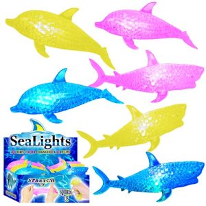 Introduce a splash of fun to your holiday fundraiser with our vibrant SeaLights Collection! This exclusive line features colorful squishy toys that resemble charming dolphins and sharks, available in delightful shades of pink, yellow, and blue. Each toy is packaged beautifully with an eye-catching box labeled "SeaLights" at the bottom left corner. Perfect for capturing the imagination of supporters while boosting your fundraising goals! Dive into success with SeaLights – a playful way to light up your fundraising season.