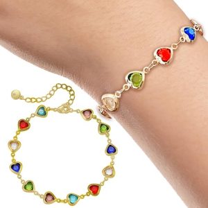 Enhance your fundraising efforts this holiday season with one of our stunning catalog offerings! Introducing the exquisite gold bracelet adorned with heart-shaped, multicolored stones. Elegantly designed, this piece adds a touch of sophistication and charm to any occasion. Picture it gracing a wrist or captivatingly displayed on its own—this bracelet promises to delight your supporters while boosting your cause's success. Elevate your fundraising catalogs with this dazzling selection today!.