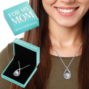 Introduce a touch of elegance to your holiday fundraising efforts with our exquisite jewelry collection. Picture the heartfelt gratitude that will light up faces as they receive our silver pendant necklace, thoughtfully designed to celebrate the amazing individuals in their lives. Each piece is beautifully presented in a sleek box, adorned with the touching message "For My Mom - Because You're Amazing." Nestled on black velvet, this necklace is not just a piece of jewelry; it's a cherished token of appreciation that supporters will be eager to purchase for their loved ones. With this timeless offering in your fundraising catalog, you're sure to inspire generosity and elevate your organization's campaign success!.