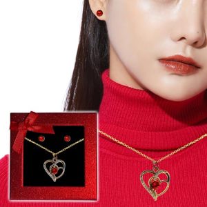 Delight in the elegance of the season with our exquisite Gold Heart-Shaped Necklace and Red Earrings set—the perfect centerpiece for your holiday fundraiser catalog! Picture a woman adorned in this stunning collection, each piece radiating warmth and sophistication. Our close-up imagery captures the enchanting allure of this matching jewelry set, nestled neatly in its luxurious red presentation box. Elevate your fundraising event by offering supporters a chance to own a piece that merges timeless beauty with festive cheer.