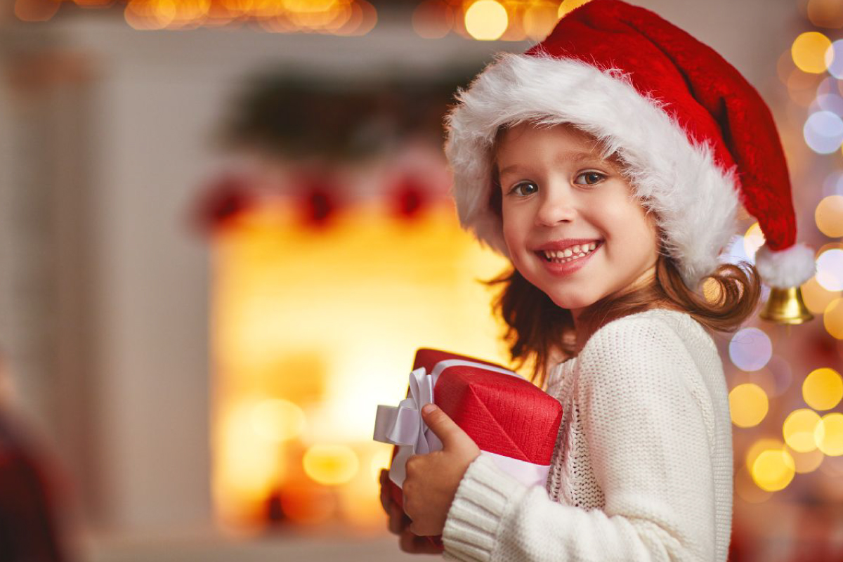 Capture the spirit of giving with our fundraising catalog! Picture the joy—a delighted child in a classic Santa hat, proudly presenting a beautifully wrapped gift in a cozy, festively decorated room. Create magical holiday moments and lasting memories for your school or organization while supporting your fundraising goals this season.